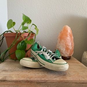 Green low-top Converse all stars